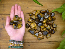 Load image into Gallery viewer, Tiger&#39;s Eye Tumble Stones
