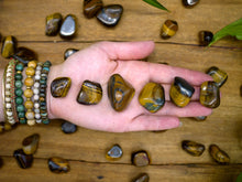 Load image into Gallery viewer, Tiger&#39;s Eye Tumble Stones
